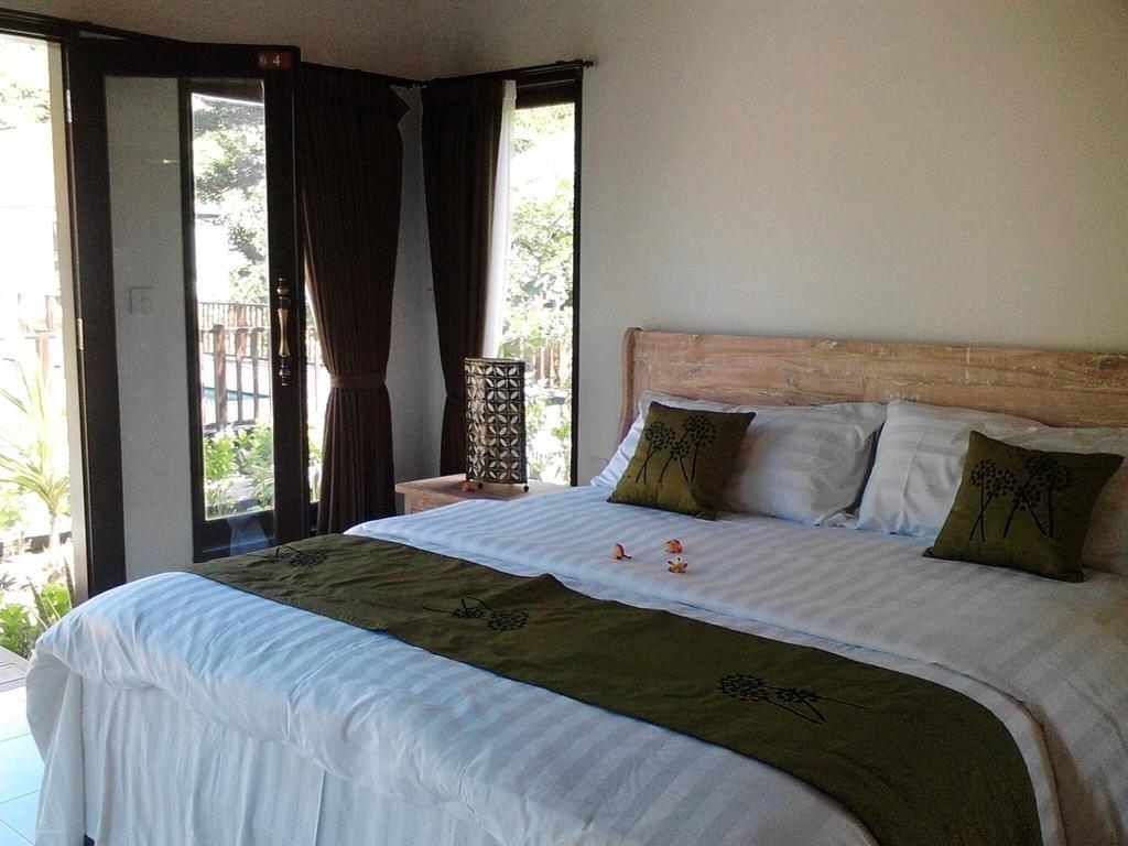Taman Dewi Sri Villa Et Bungalow Pemuteran Habitación foto